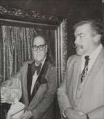 Larry next to the Charlie Miller portrait at the Magic Castle.